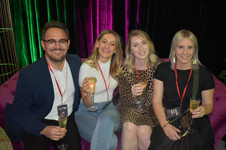 Clients and friends celebrate with Nova 93.7 at their annual Christmas Party on the balcony