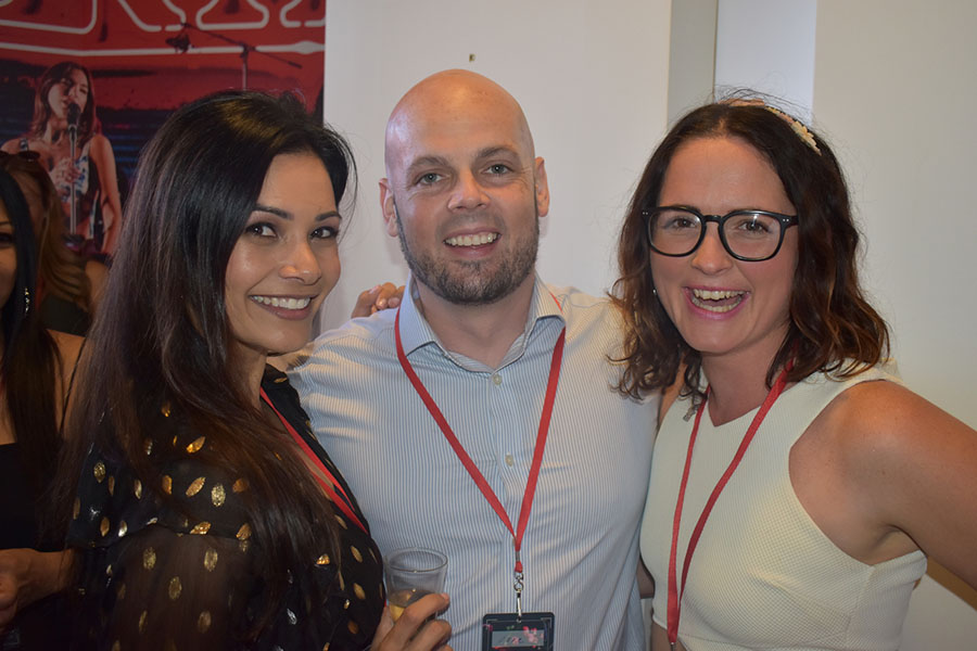 Clients and friends celebrate with Nova 93.7 at their annual Christmas Party on the balcony