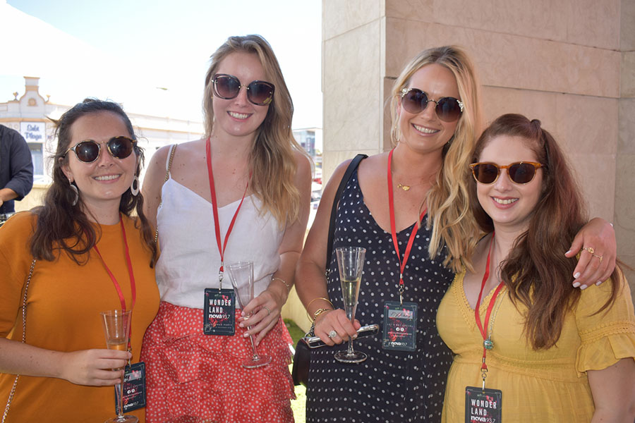 Clients and friends celebrate with Nova 93.7 at their annual Christmas Party on the balcony