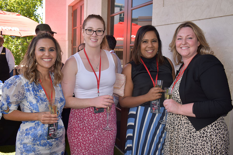 Clients and friends celebrate with Nova 93.7 at their annual Christmas Party on the balcony
