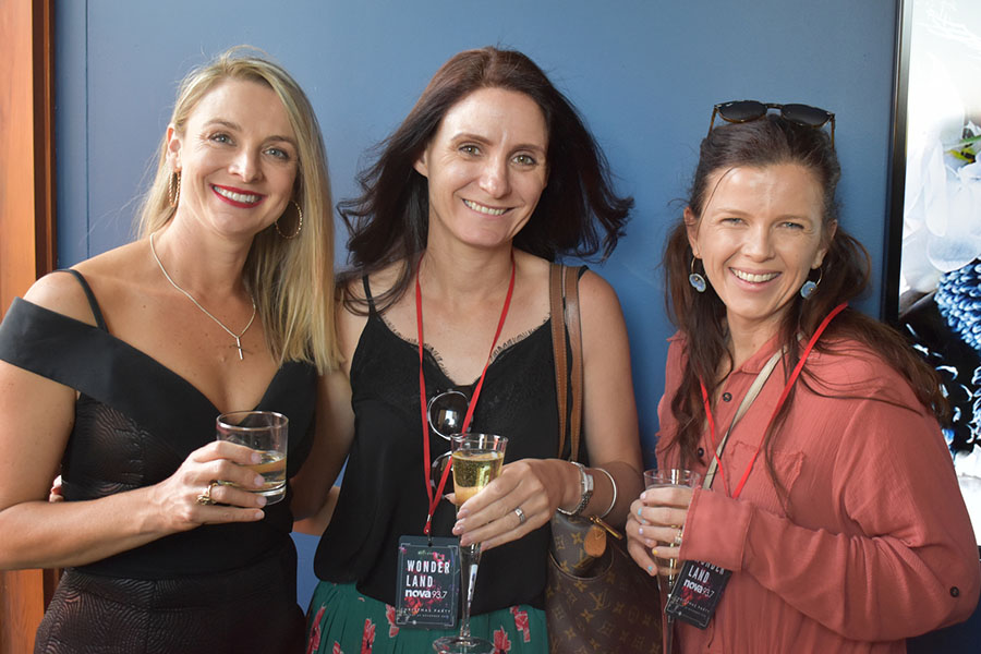 Clients and friends celebrate with Nova 93.7 at their annual Christmas Party on the balcony